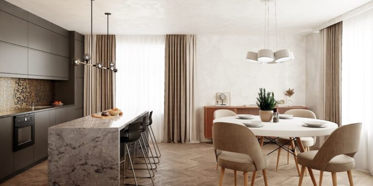 石目のアイランドカウンターがあるキッチンと、白い丸テーブルのダイニング（画像: Interiorverse）
